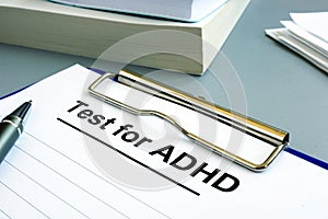 Test for ADHD form with pen and clipboard