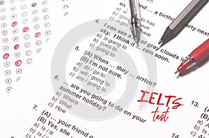 Test of English multiple choice on table. Woman takes an entrance exam