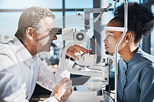 Test, eye exam or black woman consulting doctor for eyesight at optometrist or ophthalmologist. African customer testing