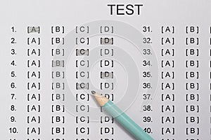 Test score sheet with answers and pencil