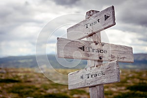 test trace track text engraved on old wooden signpost outdoors in nature