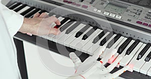 Test trials of robotic prosthesis hand playing the piano trying to press the right keys repeating for human hand.