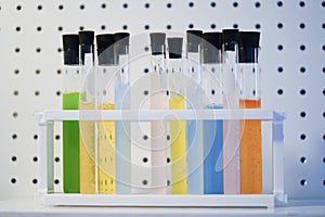 Test tube with colorful liquids in laboratory.