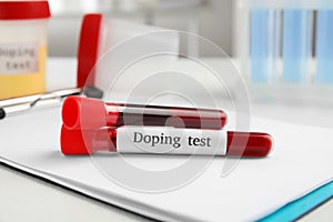 Test tubes with blood samples on white table. Doping control