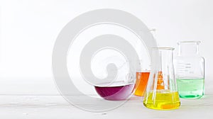 Test tubes on blue background glass chemical flasks with multicolored liquid on white background