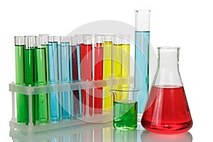 Test tubes with colorful liquids in a rack, chemical flask and b