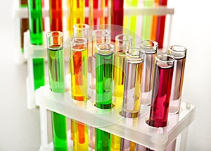Test tubes with colorful samples in laboratory, closeup