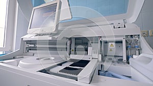 Test tubes are expecting processing by a biochemical analyzing machine