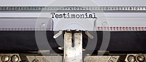 Testimonial symbol. The word `Testimonial` typed on retro vintage typewriter. Business and testimonial concept, copy space.