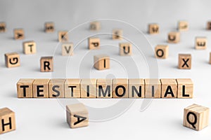 Testimonial - word from wooden blocks with letters