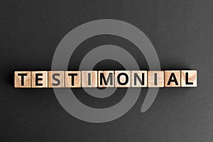 Testimonial - word from wooden blocks with letters