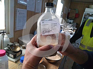 Testing aggregates on organic impurities, glass bottle photo