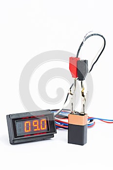 Testing battery with digital voltmeter