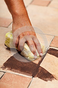 Testing the color of joint on ceramic floor tiling