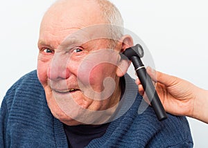 Testing Elderly Patient's Hearing With Auroscope