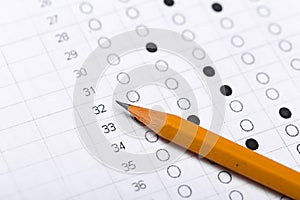Testing in exercise and exam paper. computer sheet with pencil in school test room, education concept