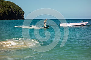 Testing a motorized surfboard in the caribbean