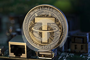 Tether USDT cryptocurrency physical coin placed on micro sheme