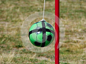 Tetherball Totem Ball attached to a red metal pole