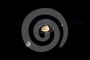 Tethys, Mimas and Enceladus orbiting around Saturn planet. 3d render