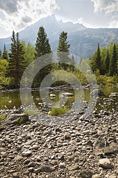 Teton Mountains from rocky shore, Cottonwood Creek, Jackson Hole