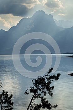 Teton Mountains, sun rays, dark clouds, Jackson Hole, Wyoming.