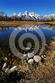Tetons Teton Mountains in Winter Snow and Trees with Reflection in River
