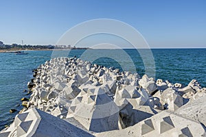 Tetra-pods or concrete breakwater blocks at Tomis, Constanta harbour. photo