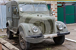 Tetyushy, Tatarstan/ Russia - May 02, 2019: Retro car GAZ-69 near the house in the street. Old vintage car GAZ-69 is a four-wheel