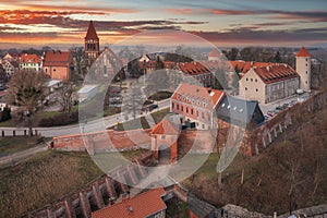 Teutonic castle in Paslek city at sunset, Poland photo