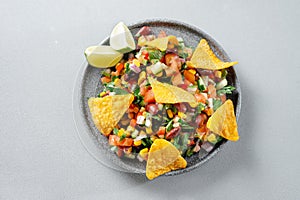 Texas caviar. Vegetarian salad on a gray plate top view on a gray background. Reducetarian, flexitarian, pescatarian