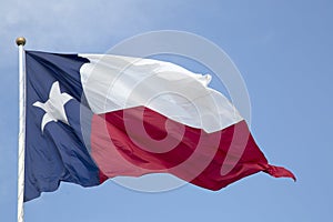 Texas state flag waving in the sky