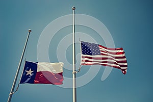 Texas and the United States flags at half-mast