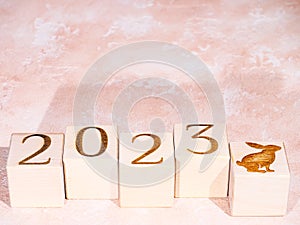 Text 2023 and rabbit symbol as motivation concept of new successes and achievements