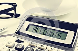 Text accounts in the display of a calculator on an office desk