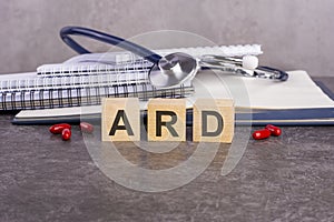 text ard on wooden blocks on a gray background, medical concept