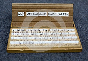 Text: Auf Optimismus umschalten photo