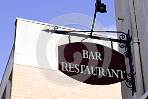 Text bar restaurant vintage retro sign on facade wall front building cafe bar in street