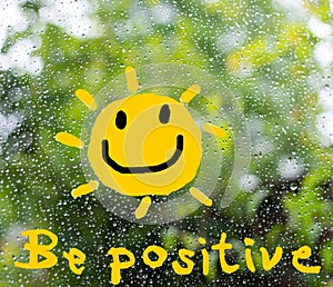 A text `be positive` in concept to cheer up