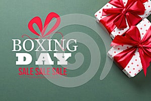 Text Boxing Day Sale and gift on background, top view