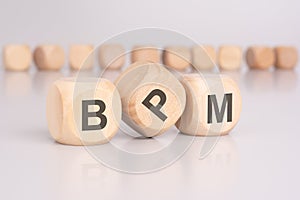 text 'BPM' - Business Process Management - on wooden cubes photo