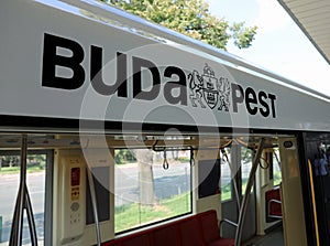 text Budapest with the logo of the capital city of Hungary on the means of transport