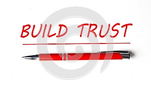 Text BUILD TRUST with ped pen on the white background