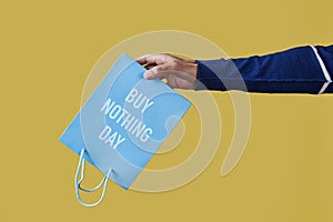 text buy nothing day written in a shopping bag