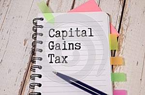 text CAPITAL GAINS TAX, business concept image with soft focus background and vintage tone