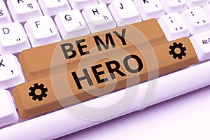 Text caption presenting Be My Hero. Business idea Request by someone to get some efforts of heroic actions for him