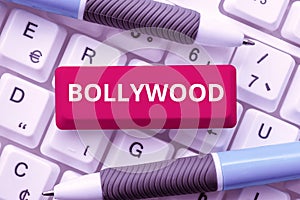 Text caption presenting Bollywood. Business overview one who organizes and assumes the risks of a business Downloading