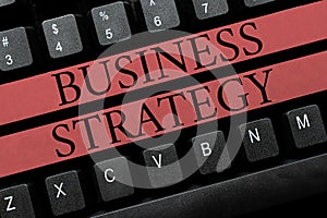 Text caption presenting Business Strategy. Concept meaning Management game plan to achieve desired goal or objective
