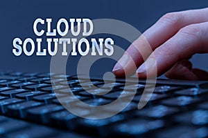 Text caption presenting Cloud Solutions. Business concept ondemand services or resources accessed via the internet Hands photo