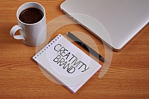 Text caption presenting Creativity Brand. Word for design name or feature that distinguishes organization Closed Laptop